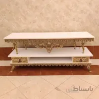 میز تلویزیون برنزی صفحه هایگلاس تسمه پنج گل تاج دار