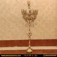 آباژور برنزی ایستاده کنار سالنی فرشته پایه گرد