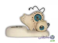 جاشمعی گربه ماهی به دل و بچه | 1026 ا ابعاد تقریبی : 15x10 cm به علت دست ساز بودن تمامی محصولات، احتمال اندکی تفاوت وجود دارد نکته مهم : طرح روی بدن مجسمه ها ممکن است با طرح روی عکس متفاوت باشد