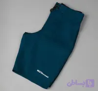 شلوارک ورزشی مردانه مدل فیزیک تک رنگ موتی سبز تیره