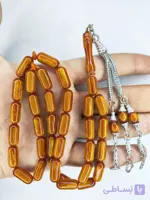 تسبیح کهربا پودری زرافشان 33عددی تراش کپسولی خوشدست و زیبا رنگ عسلی همراه با سر تسبیح استیل شکیل