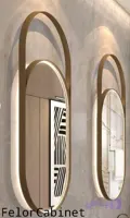 آینه بک‌لایت بیضی ایستاده با فریم استیل طلایی