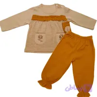 ست بلوز و شلوار دخترانه پیراهن کرمی طرح گل و شلوار آجری سایز 30و35