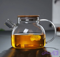 قوری مدل پیرکس رنگ شامپاینی شعله مستقیم گنجایش 1 لیتر بدنه شیشه آنتی شوک در بامبو واشردار صافی چای و دمنوش ابعاد