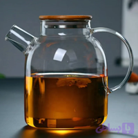 قوری مدل پیرکس رنگ شامپاینی شعله مستقیم گنجایش 1.5 لیتر بدنه شیشه آنتی شوک در بامبو واشردار صافی چای و دمنوش ابعاد