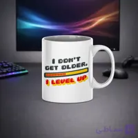 ماگ سرامیکی گیمینگ طرح I DON’T GET OLDER – I LEVEL UP