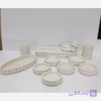 هفت سین کمر مرواریدی شش تا کاسه جا سبزه ای جا آینه ای یه جفت جا شمعی ظرف سیب