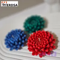 شمع گل داوودی شکوفه‌ای رنگارنگ برای جشن سال نو