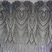 پارچه تور کار شده مجلسی طرح مرجان رنگ مشکی با کار شده طلایی