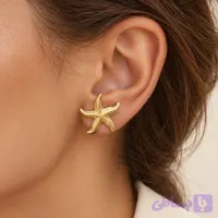گوشواره میخی زنانه طرح ستاره دریایی پترن‌دار طلایی