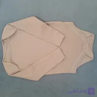 بادی آستین بلند نوزادی وارداتی سایز۶تا۱۲ماه پهنا۲۶فاق۴۲