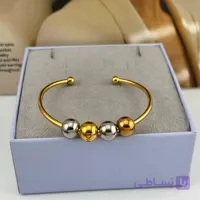 دستبند ژوپینگ چهار گوی طلایی و نقره‌ای