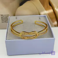 دستبند طلایی باز با گره قلبی