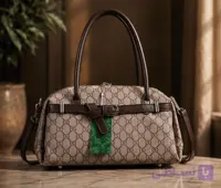 کیف دستی زنانه کوچ مدل دافل طرح مونوگرام