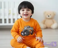 ست بلوز و شلوار بچگانه طرح ماشین هیولا رنگ نارنجی – لباس راحتی دورس پنبه‌ای