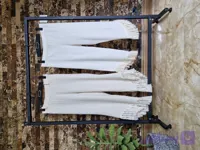شلوار دخترانه لینن ترک مدل ریش دار کرم