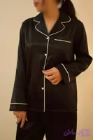 بلوز آستین‌بلند و شلوار مشکی با خط سفید