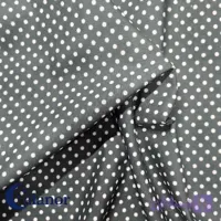 پارچه ملحفه‌ای مشکی خال‌خالی سفید