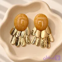 گوشواره آویز طلایی مدل آبشاری با نگین عسلی بیضی