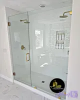 کابین فریم لس لولایی با یراق استیل طلایی شیشه 8 میل سکوریت