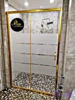 کابین فریم دار کشویی با رنگ فریم طلایی و شیشه سکوریت 6 میل طرح راه مات
