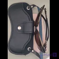 جاعینکی گردنی چرم طبیعی مدل جیب زیپ دار برای دستمال عینک